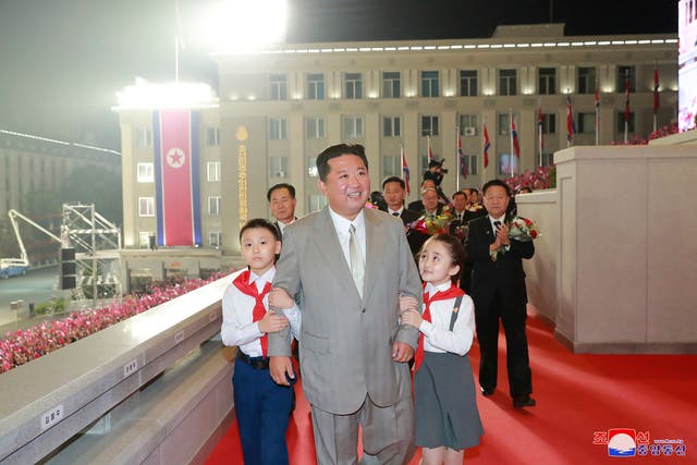 <p>North Korean leader Kim Jong Un walks with children during a celebration of the nation’s 73rd anniversary </p>