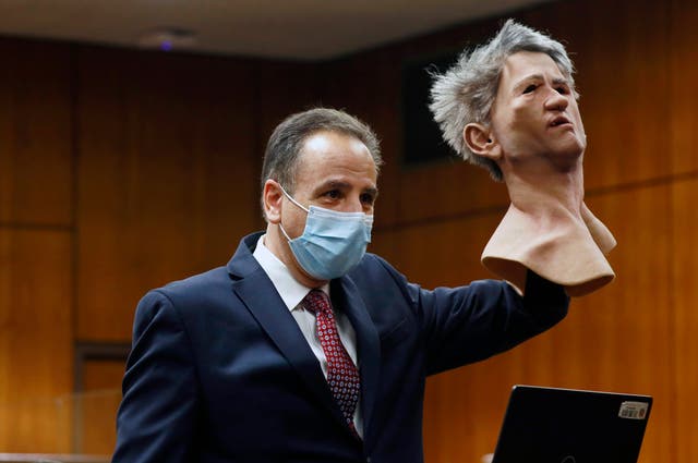 <p>Deputy District Attorney Habib A. Balian holds a rubber latex mask, worn by Robert Durst when police arrested him, Wednesday, Sept. 8, 2021 in Inglewood, Calif. </p>