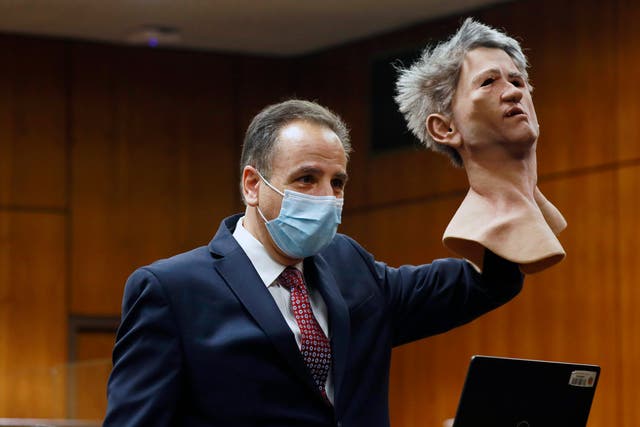<p>Deputy District Attorney Habib A. Balian holds a rubber latex mask, worn by Robert Durst when police arrested him, Wednesday, Sept. 8, 2021 in Inglewood, Calif. </p>