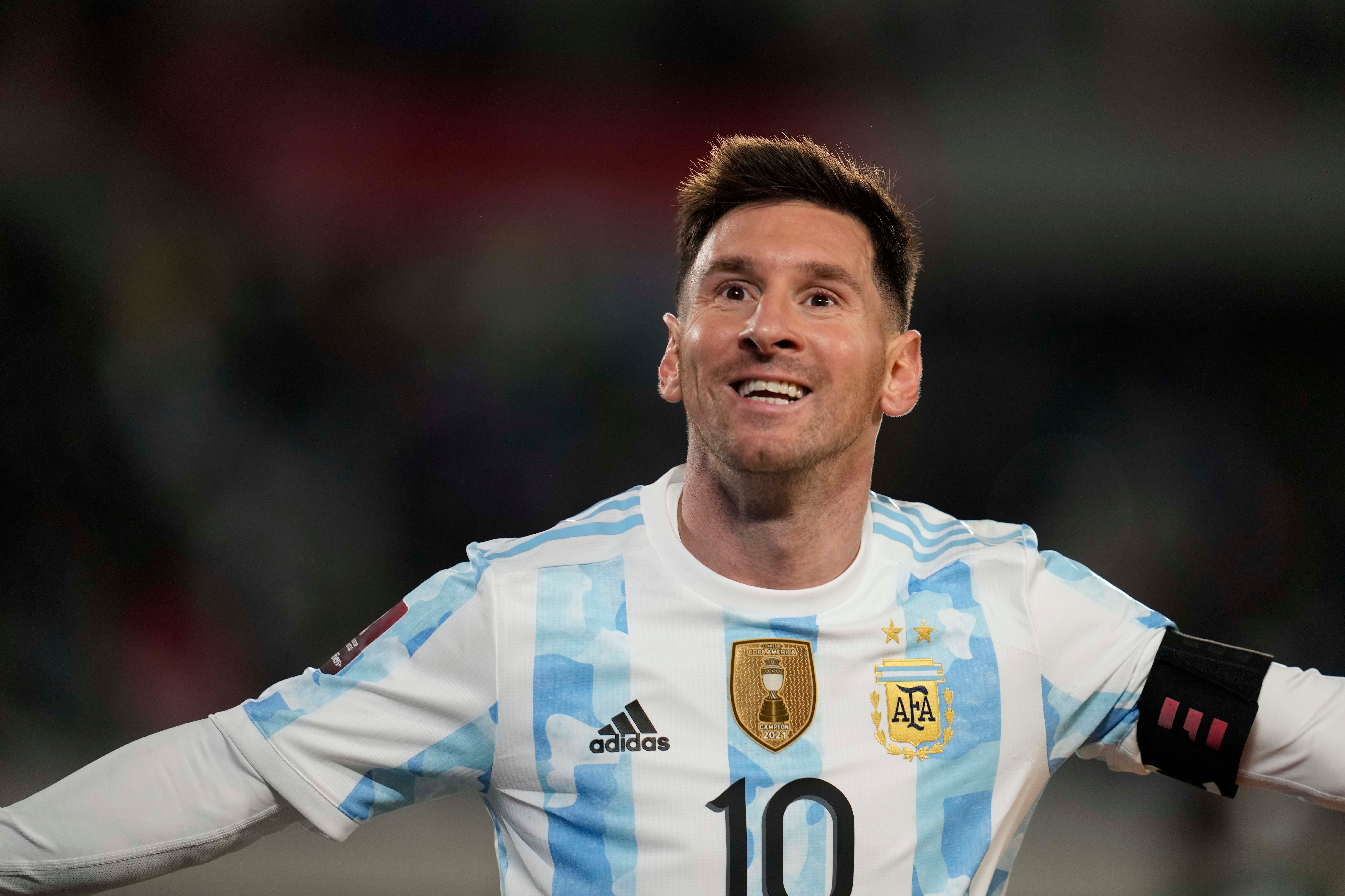 Argentina’s Lionel Messi celebrates scoring his team?s third goal against Bolivia (Natacha Pisarenko/AP)