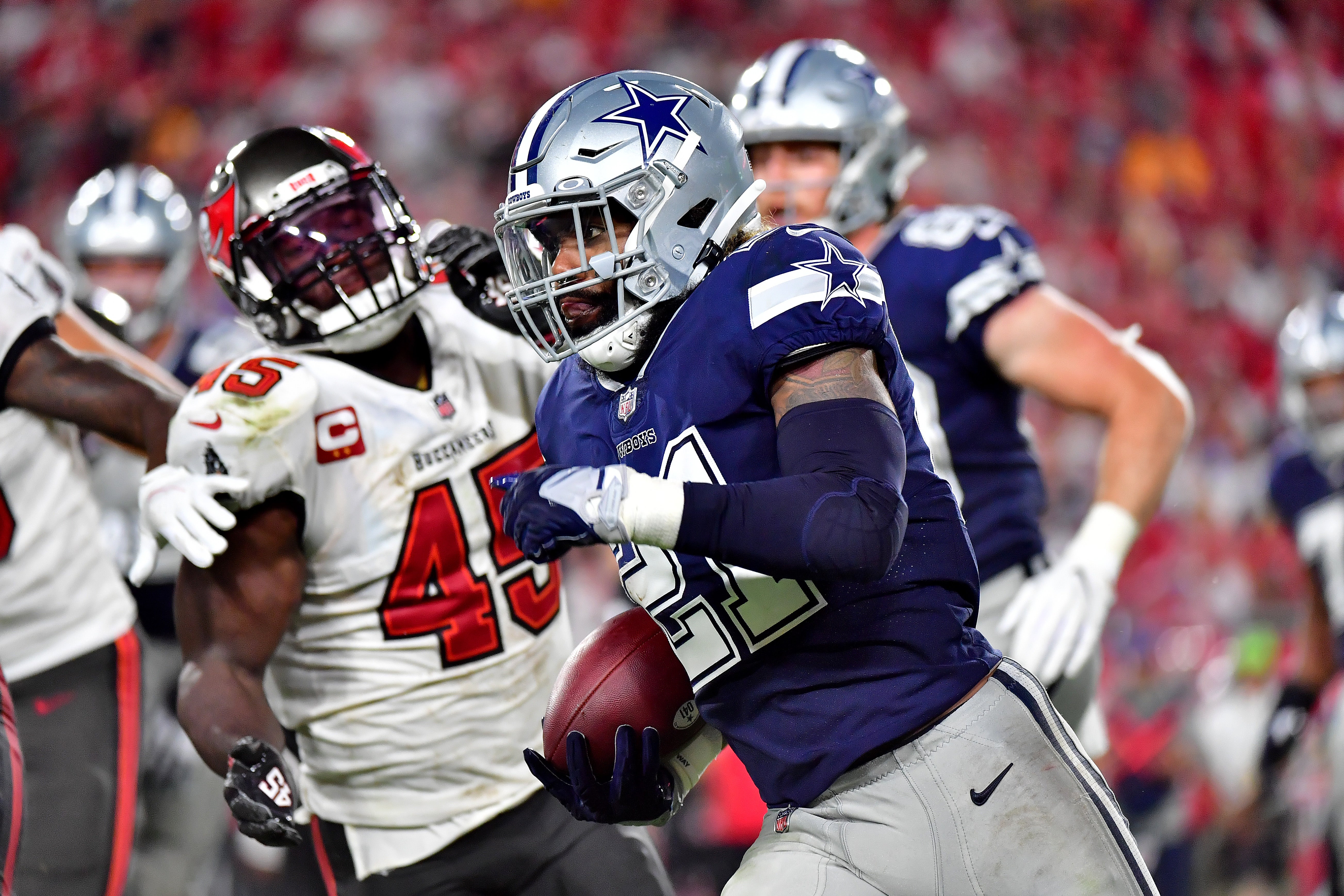File image: Ezekiel Elliott #21 of the Dallas Cowboys carries the ball against the Tampa Bay Buccaneers