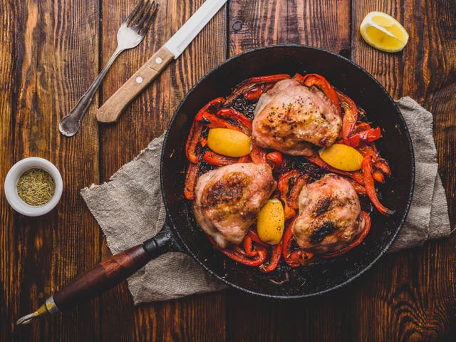 <p>Chicken perfumed with garlic and rosemary is an easy, welcome partner for peppers in this dish</p>