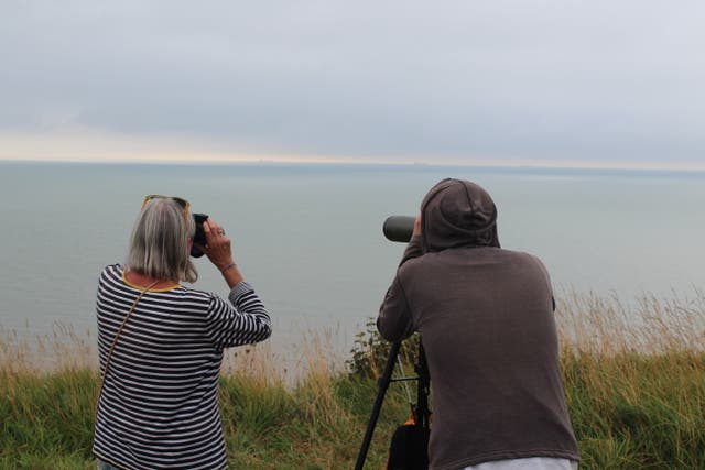 <p>Volunteers from Channel Rescue scan the horizon for migrant boats on 10 September, 2021. </p>