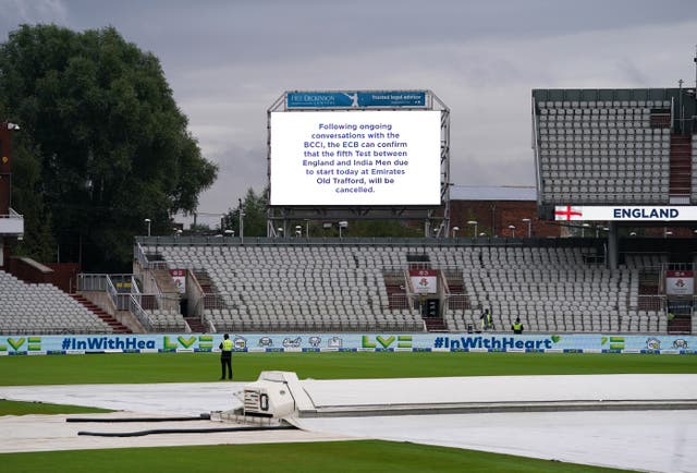 The big screen at an empty Emirates Old Trafford carries the news of the cancelled Test (Martin Rickett/PA)