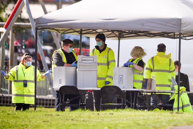 <p>Members of the public get tested at a mobile testing centre in West Dunbartonshire, which has the highest Covid rate in the UK</p>
