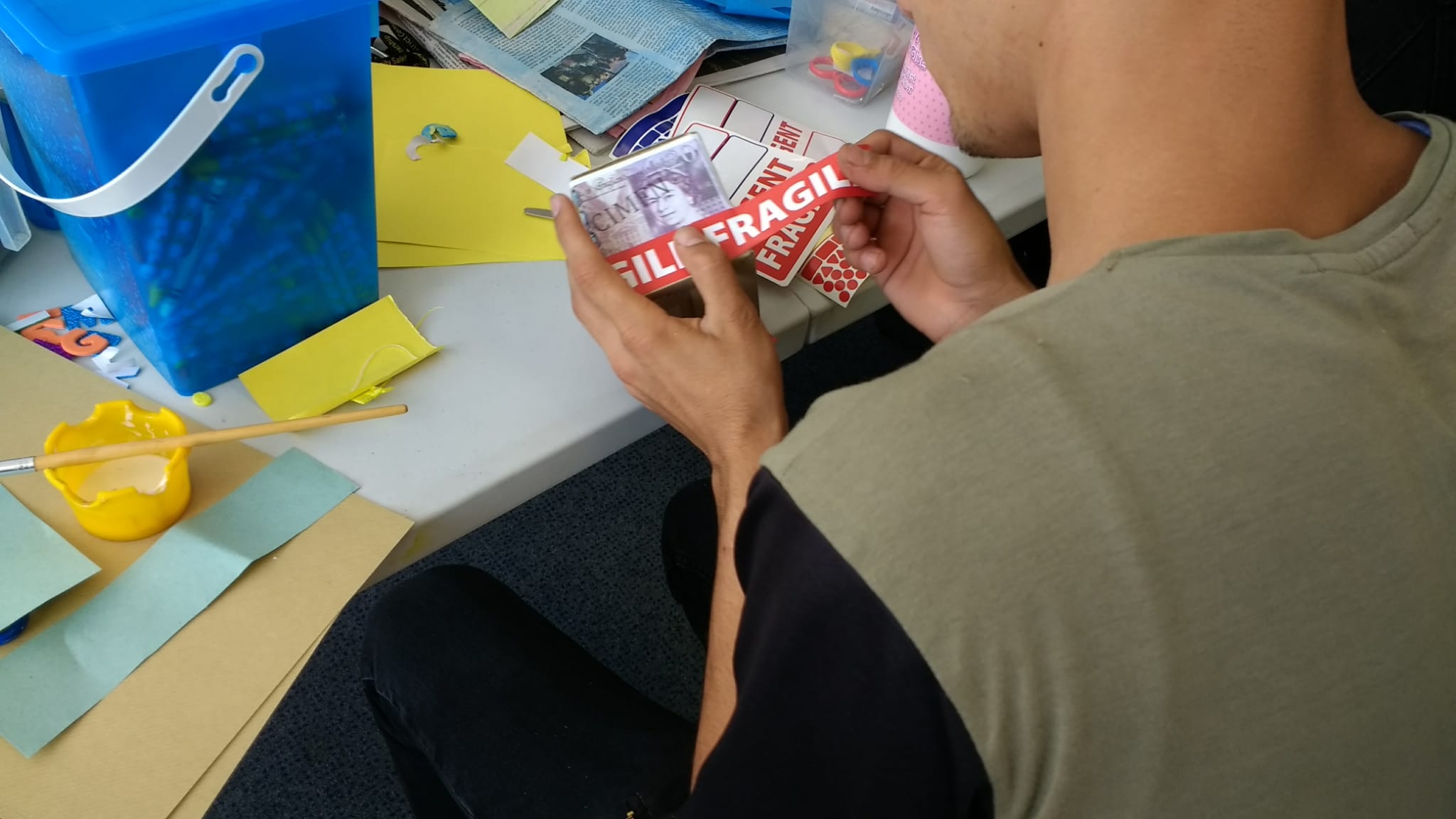 An Afghan boy attends one of the Kent Action Refugee Network’s (KRAN) art workshops.