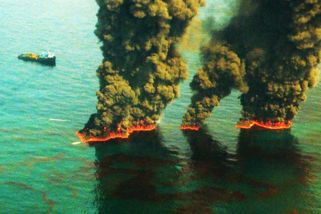 <p>Plumes of smoke rise from a controlled burn during the Deepwater Horizon oil spill in 2010</p>