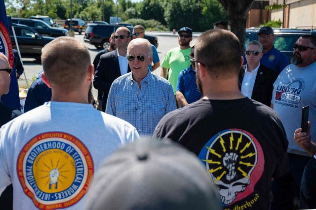 <p>President Joe Biden speaks with union workers as he visits the International Brotherhood of Electric Workers (IBEW) Local 313 in Newcastle, Delaware on September 6, 2021</p>