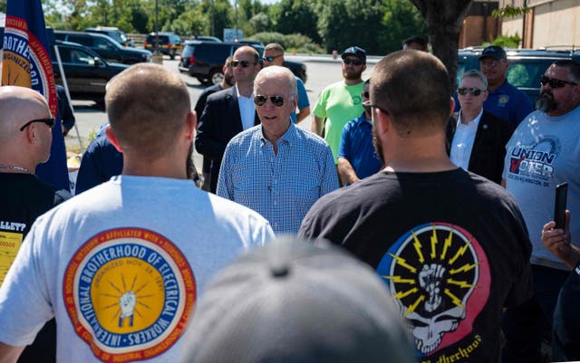 <p>President Joe Biden speaks with union workers as he visits the International Brotherhood of Electric Workers (IBEW) Local 313 in Newcastle, Delaware on September 6, 2021</p>