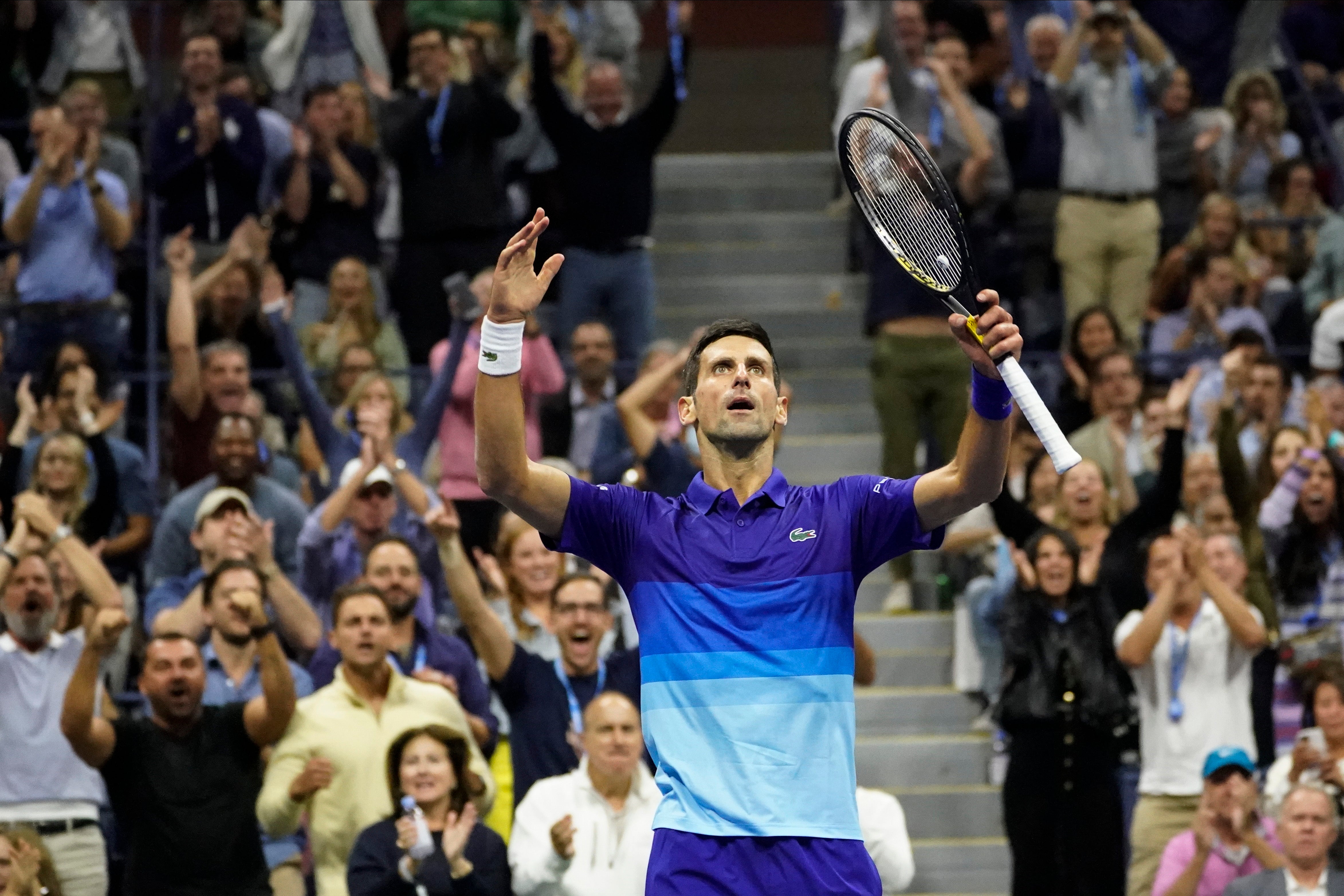 Novak Djokovic celebrates winning the third set (Elise Amendola/AP)