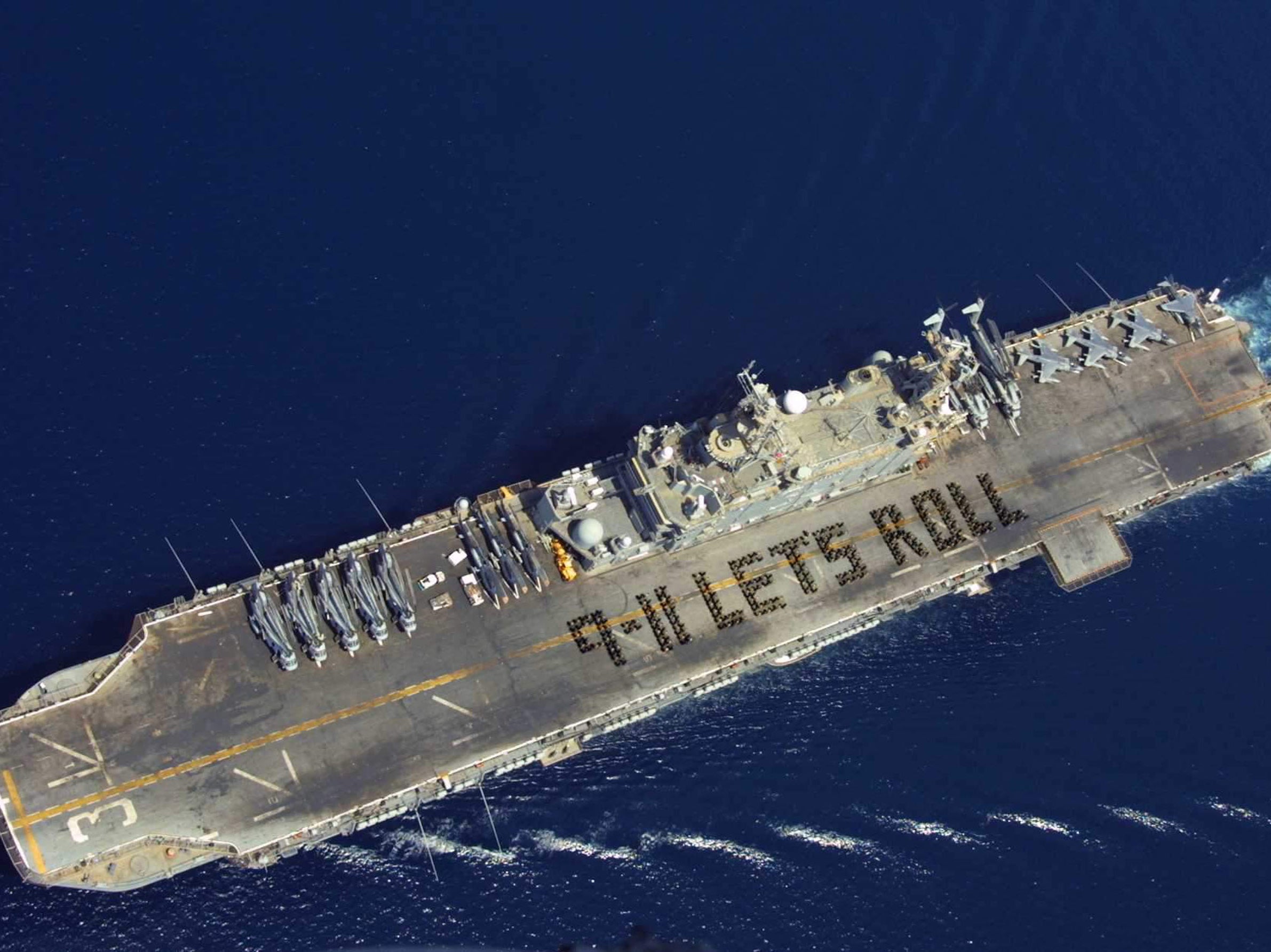 More than 500 Marines and Sailors spell out the now famous quote from Todd Beamer, on the flight deck of a ship on 6 September, 2002