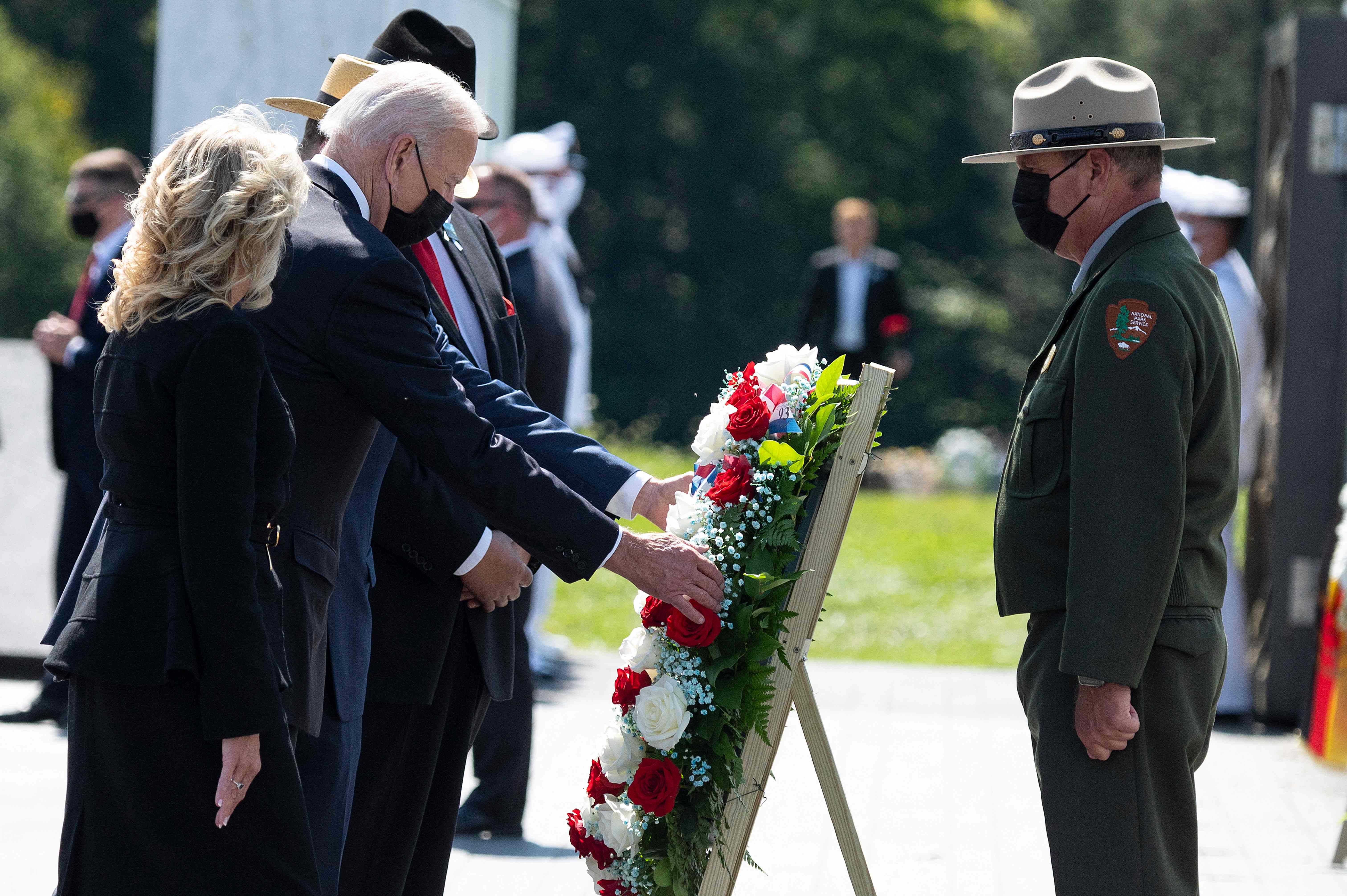 US President Joe Biden and First Lady Jill Biden lay a wreath at the Flight 93 National Memorial, marking the 20th anniversary of the 9/11 attacks, on September 11, 2021, in Shanksville, Pennsylvania. (Photo by Jim WATSON / AFP) (Photo by JIM WATSON/AFP via Getty Images)