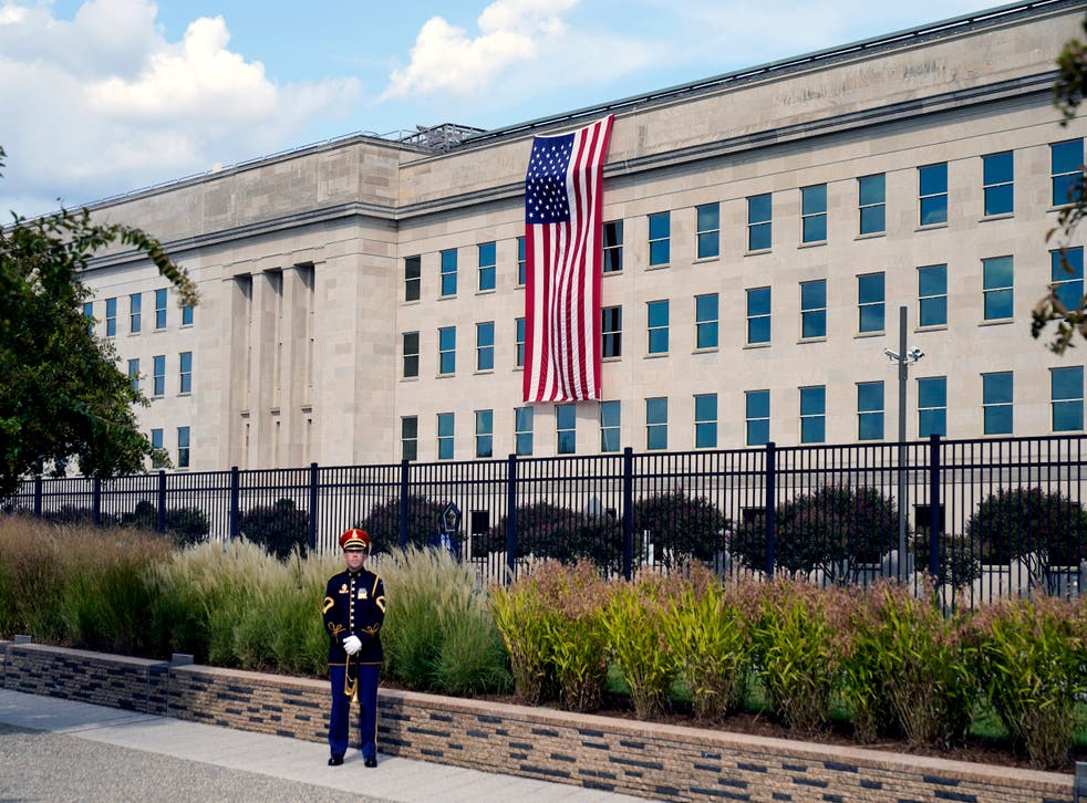 pA U.S. Army band bugler stands ready on the National 9/11 Pentagon Memorial site for a ceremony with President Joe Biden, first lady Jill Biden, Vice President Kamala Harris and her husband Douglas Emhoff, Secretary of Defense Lloyd Austin and Joint Chiefs Chairman Gen. Mark Milley, Saturday, Sept. 11, 2021 at the Pentagon in Washington, on the 20th anniversary of the terrorist attacks. The National 9/11 Pentagon Memorial, opened in 2008, commemorates the lives lost at the Pentagon and onboard American Airlines Flight 77. (AP Photo/Alex Brandon)/p