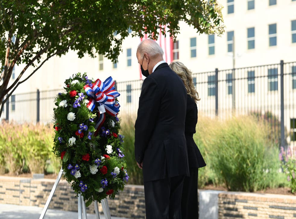 pUS President Joe Biden and First Lady Jill Biden attend a wreath laying ceremony as they pay their respects to 9/11 victims at the Pentagon, Virginia, September 11, 2021. (Photo by Brendan SMIALOWSKI / AFP) (Photo by BRENDAN SMIALOWSKI/AFP via Getty Images)/p