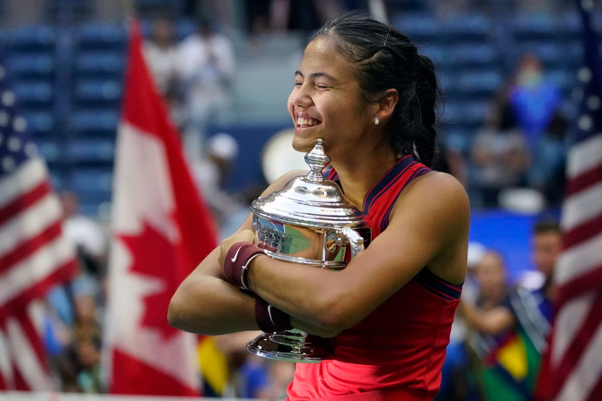 Emma Raducanu embraces US Open trophy after unprecedented triumph