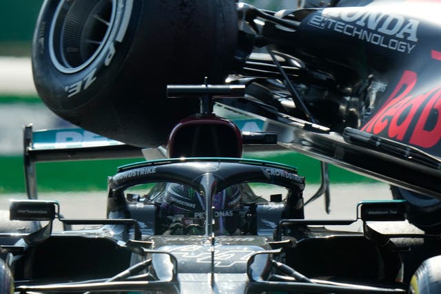 <p>Max Verstappen’s Red Bull goes over Lewis Hamilton’s Mercedes</p>