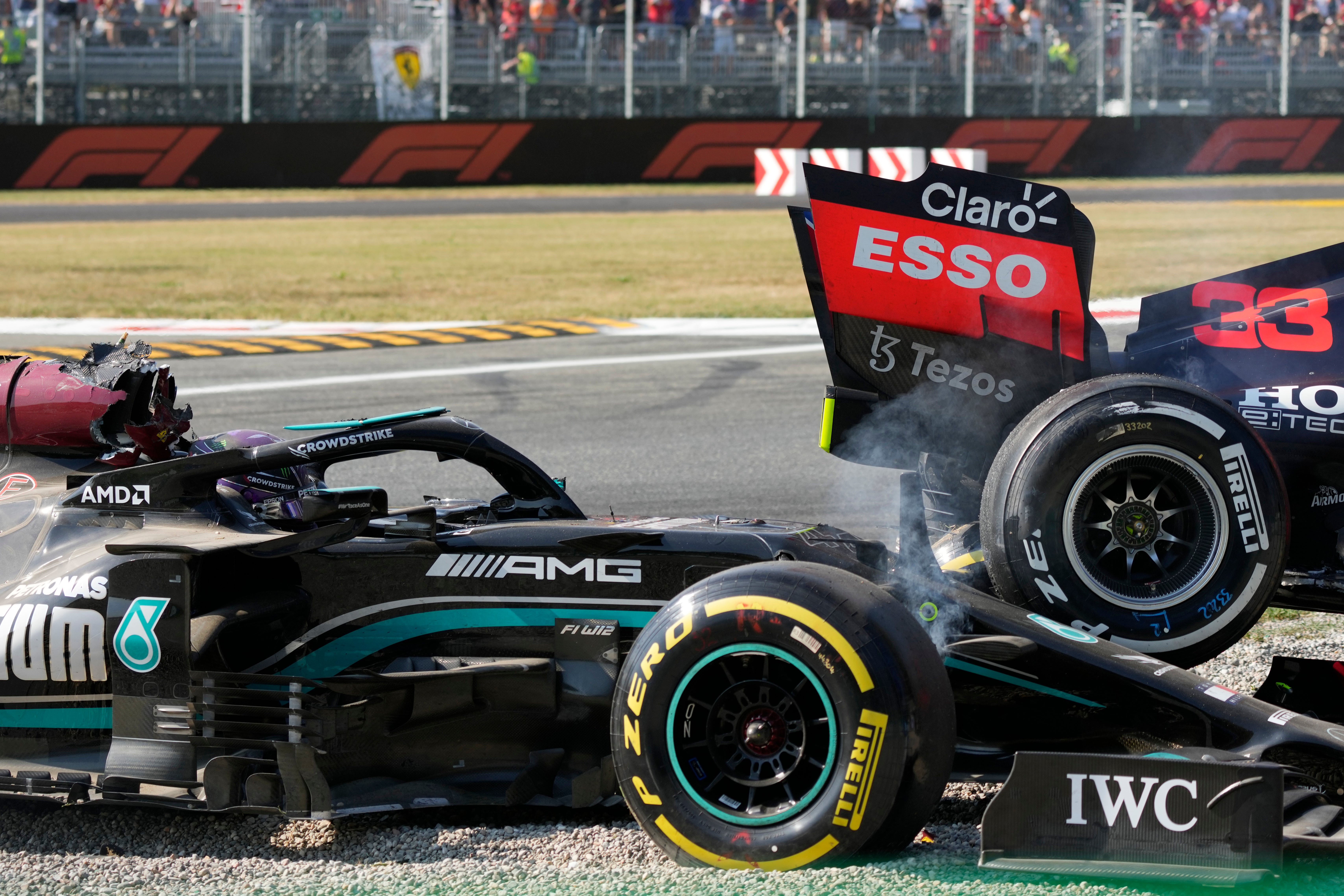 Lewis Hamilton, Toto Wolff and Christian Horner were grateful for the halo on the Briton’s Mercedes car (Luca Bruno/AP)