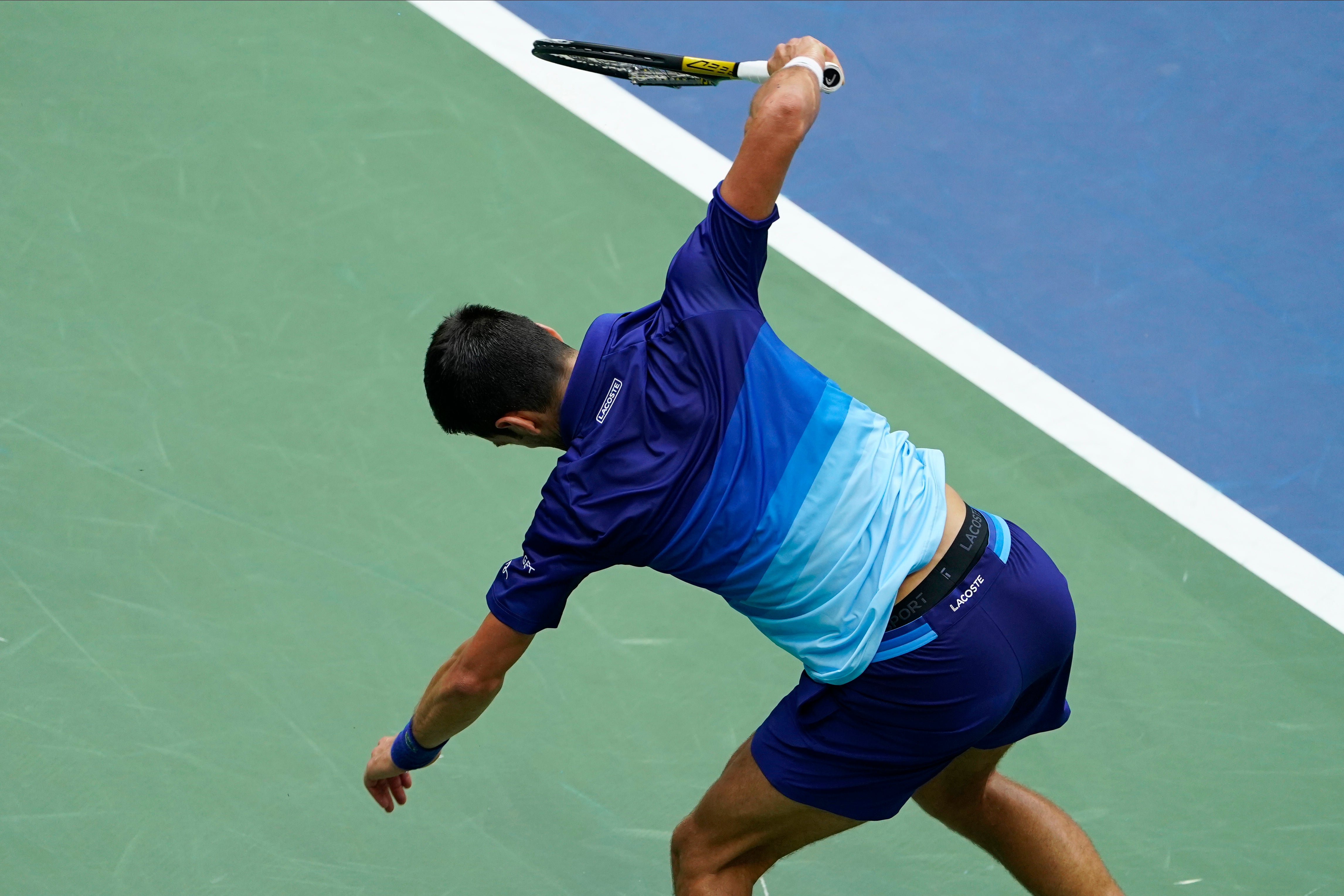 Novak Djovokic smashing his racquet on the ground in the US Open final