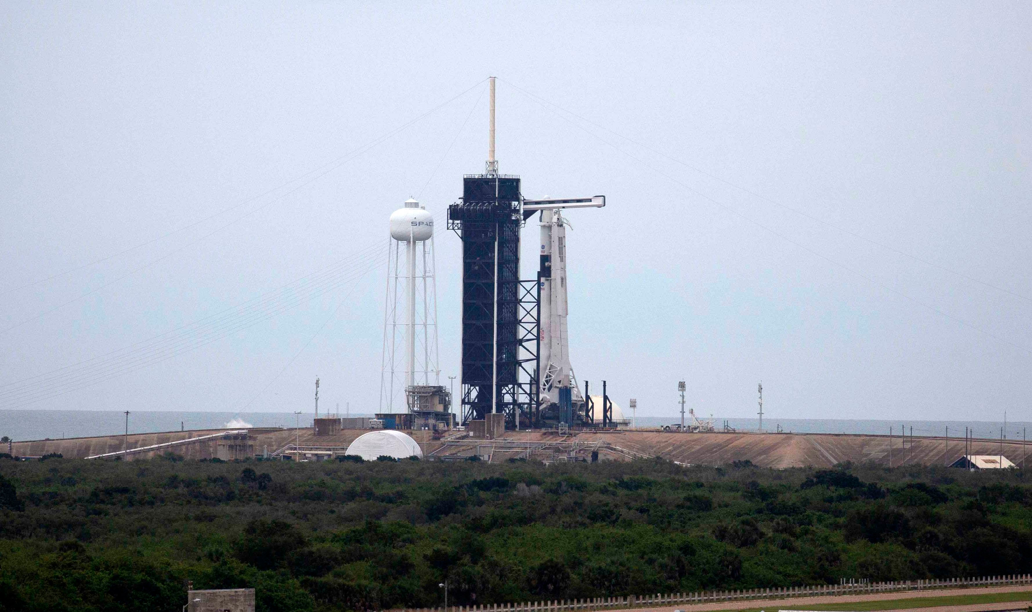 File: SpaceX Falcon 9 rocket with Crew Dragon spacecraft sits on launch pad 39A at the Kennedy Space Center on 27 May 2020 in Cape Canaveral, Florida