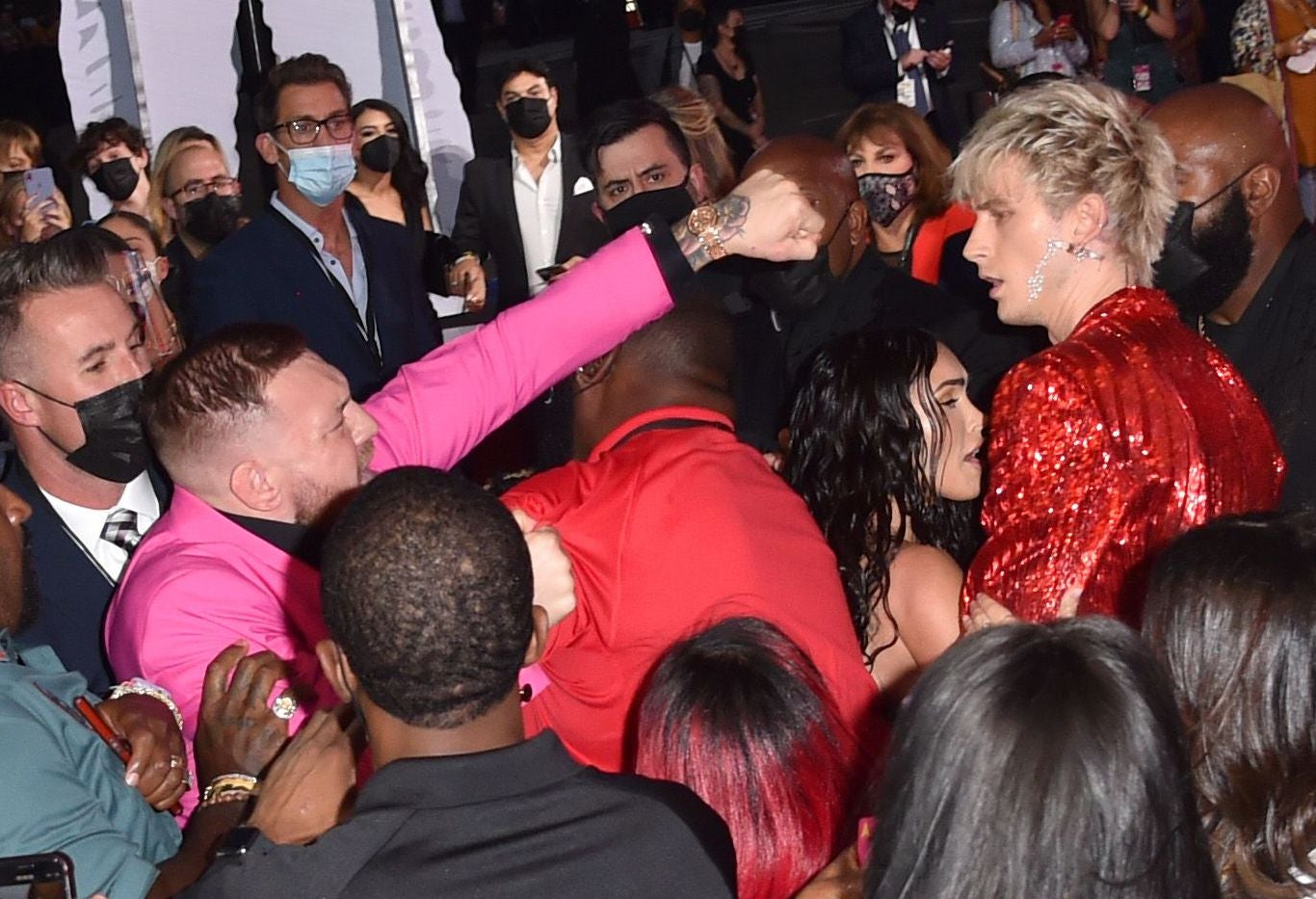 Conor McGregor appears to throw a punch towards Machine Gun Kelly at the MTV Video Music Awards in New York
