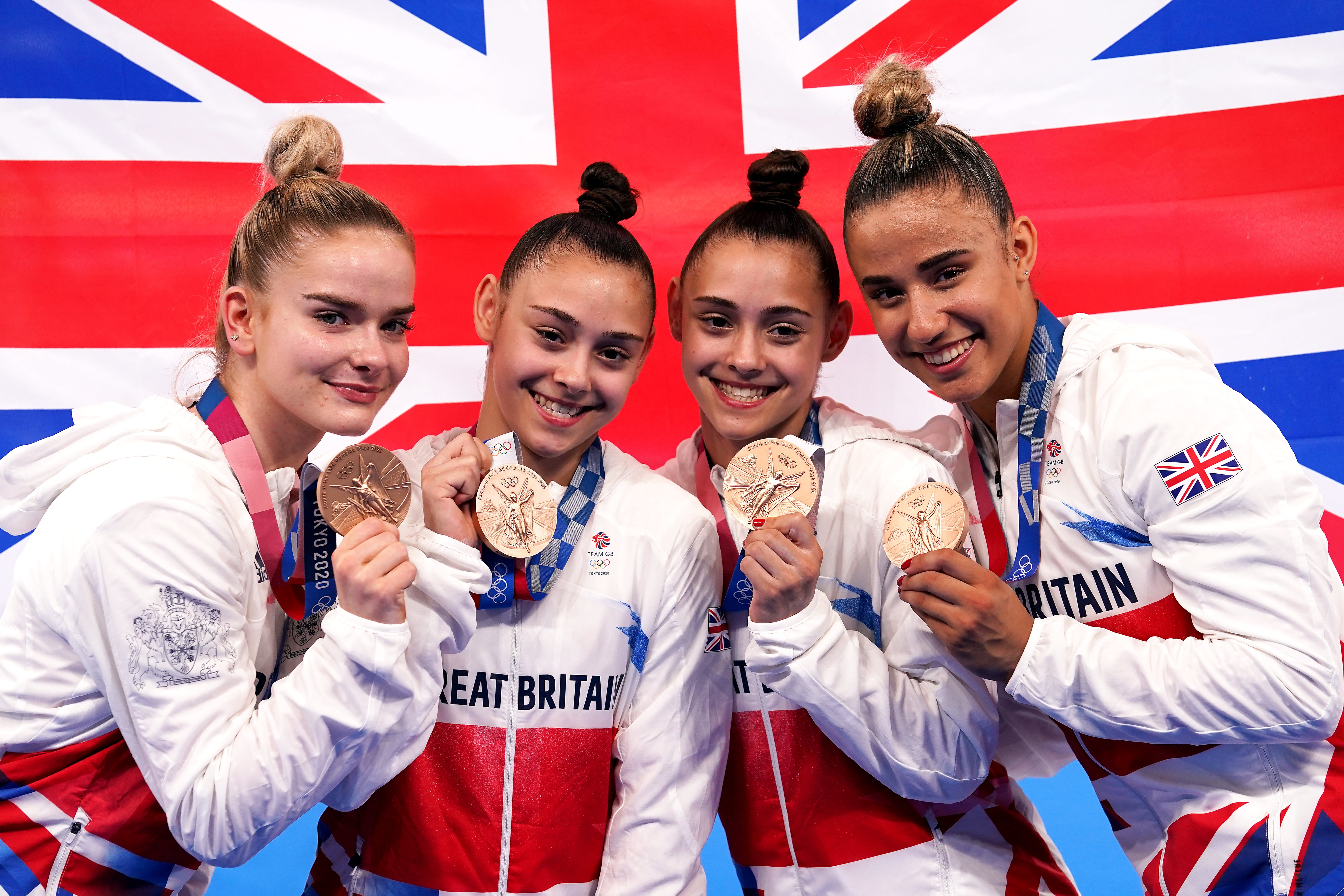 The Gadirova twins (centre) earned improbable Olympic bronze (Martin Rickett/PA)