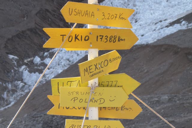 <p>On top of the world: a signpost at base camp at the foot of Aconcagua in Argentina – a candidate for removal from the red list</p>