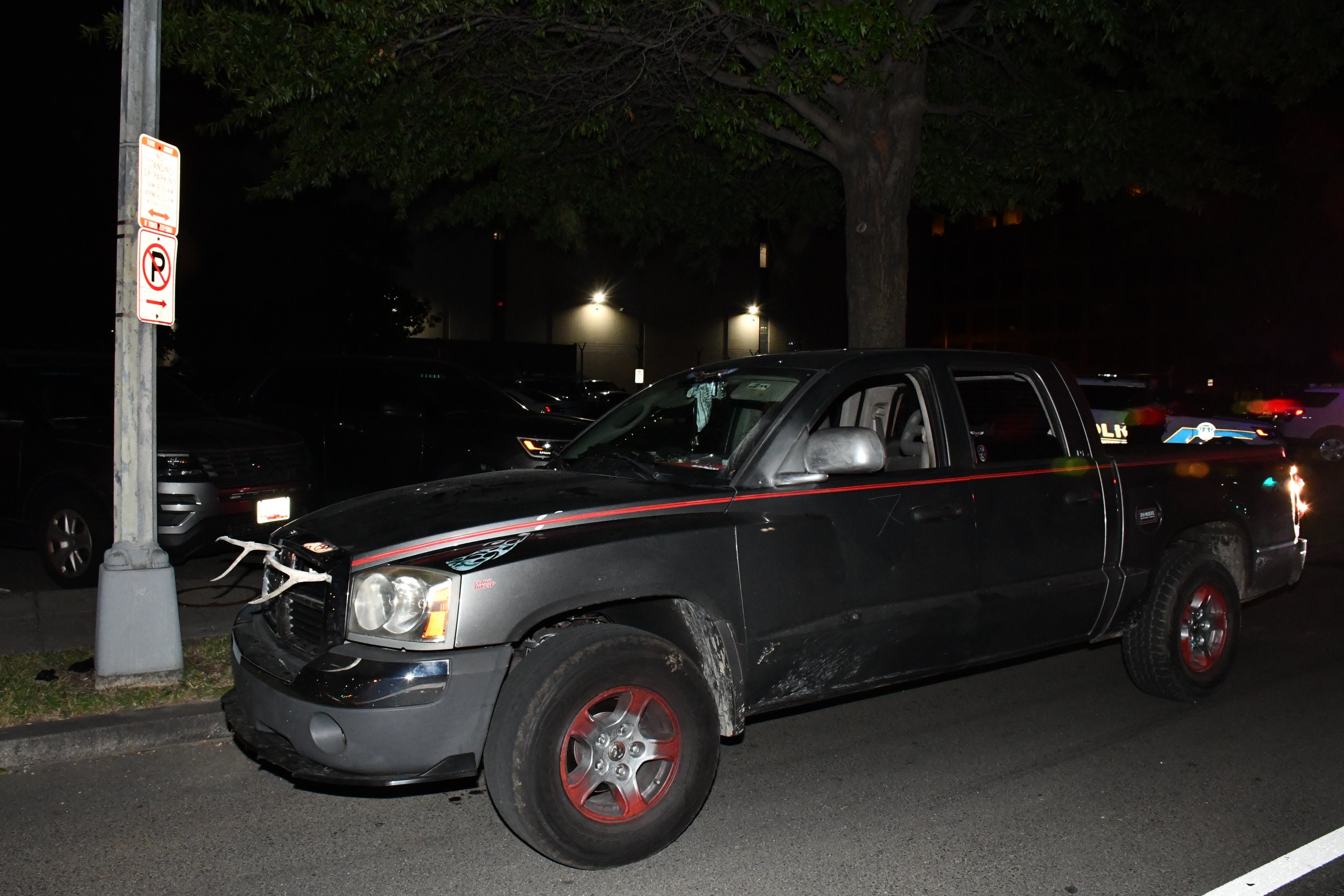 The truck appears to have been fitted with antlers at the front and had an American flag where the license plate was supposed to be