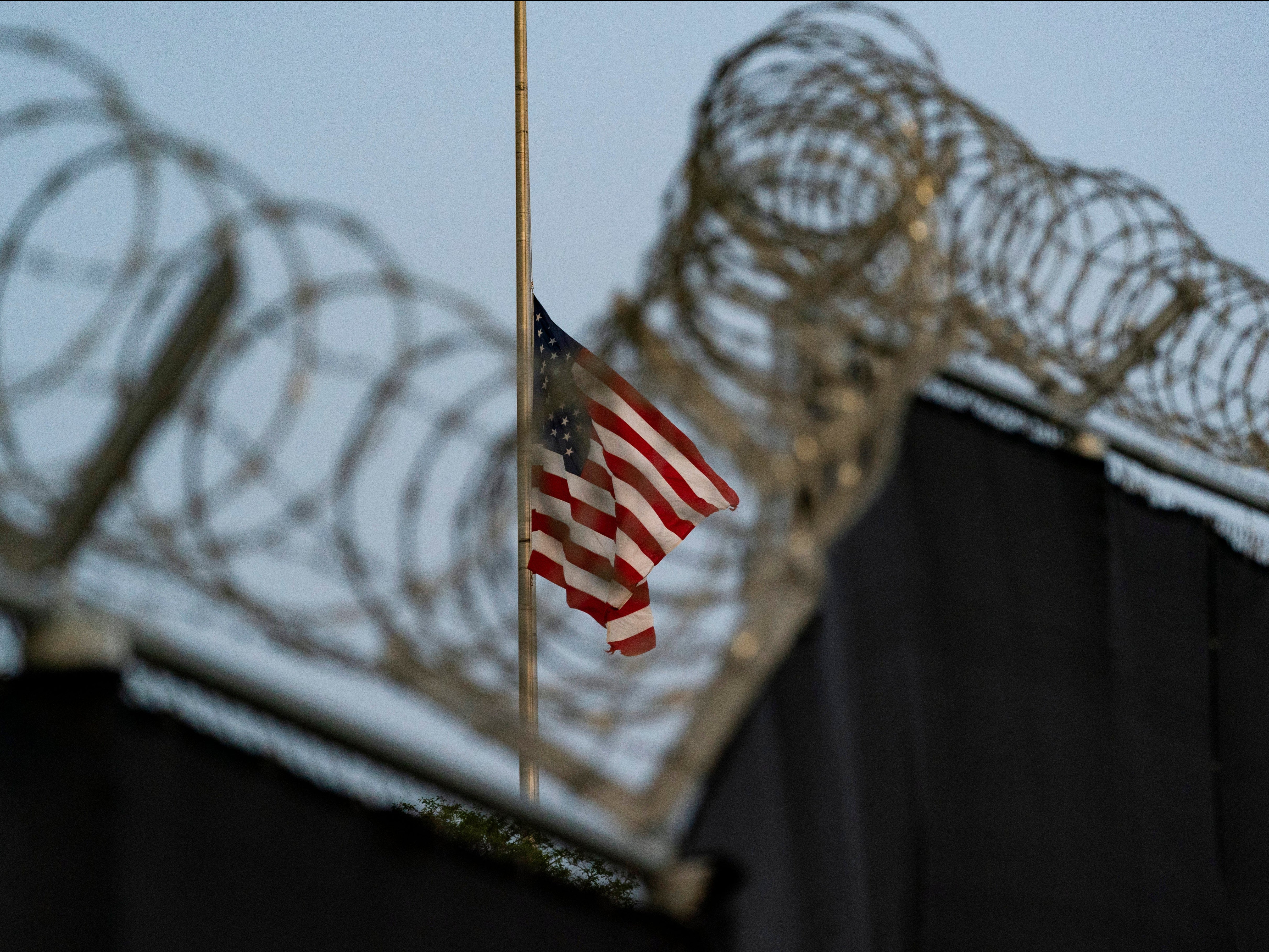 A flag flying at half mast at Guantanamo Bay’s Camp Justice mast for the victims of a terror attack in Kabul