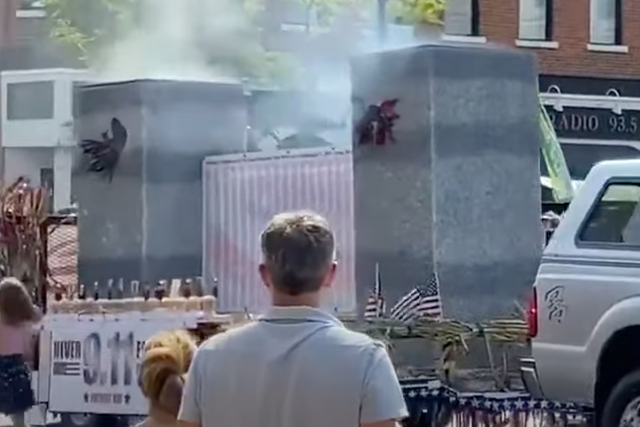 <p>A Porter County Republican Party parade float depicting the World Trade Centre Twin Towers smoking and with flaming holes on its side. The float was part of a parade for the Valparaiso, Indiana Popcorn Festival, which was held on 11 September.</p>