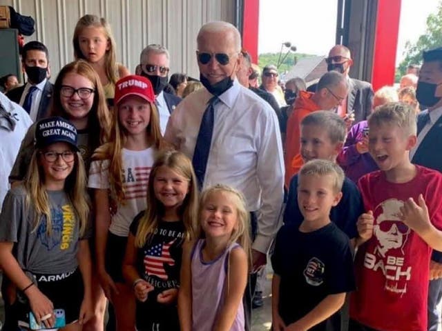 <p>President Joe Biden posed for a photo with children wearing pro-Trump clothing</p>