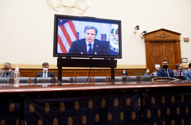 <p>US Secretary of State Antony Blinken appears on a television screen as he testifies virtually on the US withdrawal from Afghanistan during a House Foreign Affairs Committee hearing on Capitol Hill in Washington, DC</p>