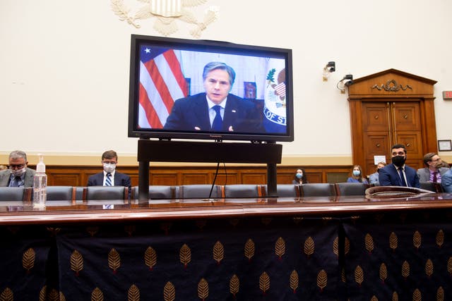<p>US Secretary of State Antony Blinken appears on a television screen as he testifies virtually on the US withdrawal from Afghanistan during a House Foreign Affairs Committee hearing on Capitol Hill in Washington, DC</p>