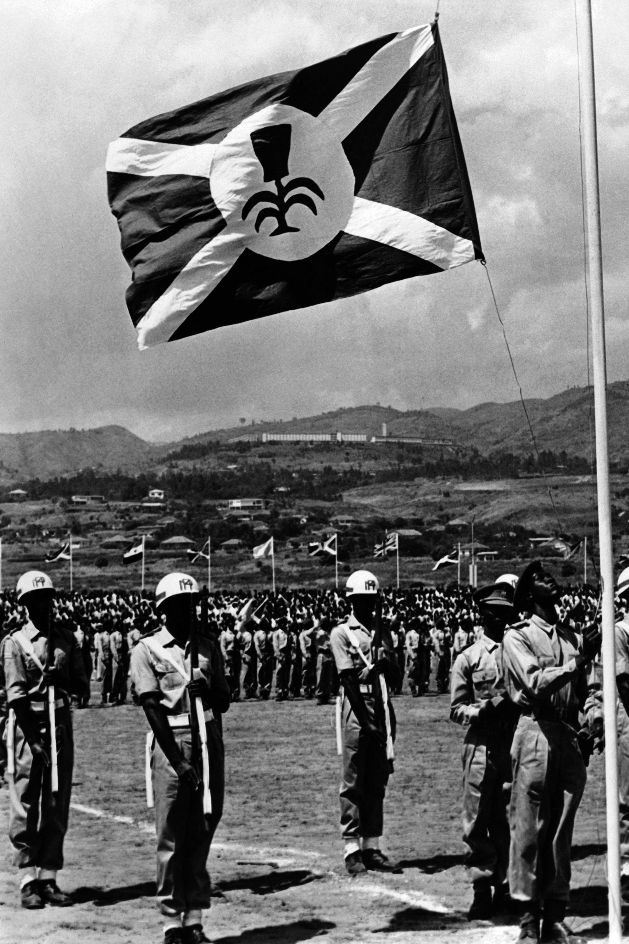 The flag of the newly born independent Kingdom of Burundi is hoisted on a flagpole in the Prince Rwagasore Stadium in Bujumbura in 1962