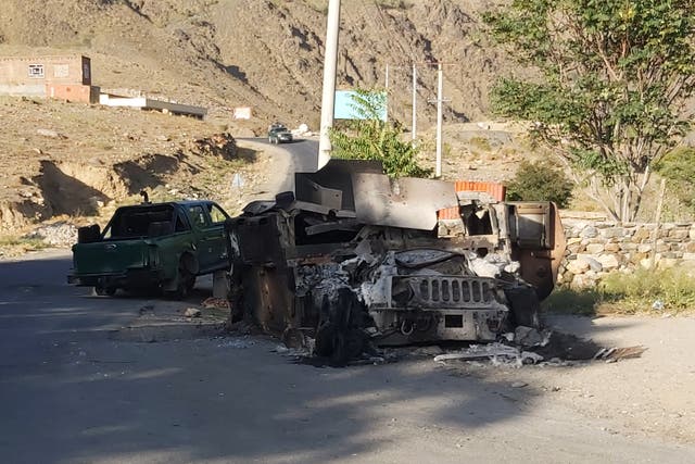 <p>File: In this photograph taken on 6 September 2021, a burnt down Humvee is seen along a road in Dashtak, Panjshir province</p>