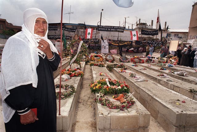 <p>A Lebanese woman by the graves of the 105 civilians killed when Israeli artillery shelled the UN compound in Qana during Israel's ‘Grapes of Wrath’ offensive</p>