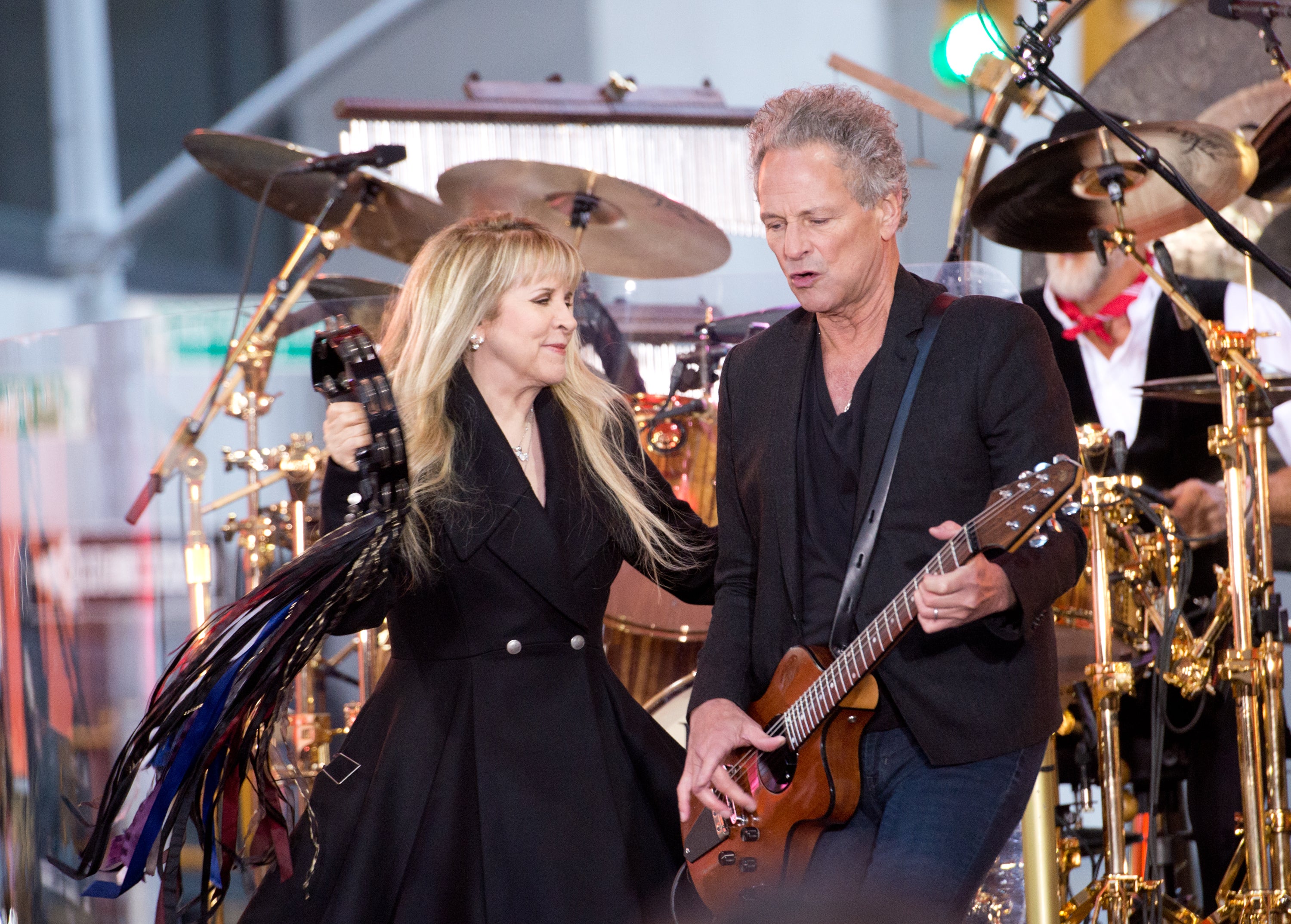 With former partner and Fleetwood Mac bandmate Stevie Nicks in 2014