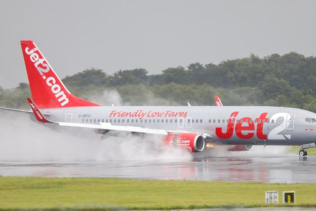 <p>A Jet2 Boeing 737 touches down at Manchester Airport</p>