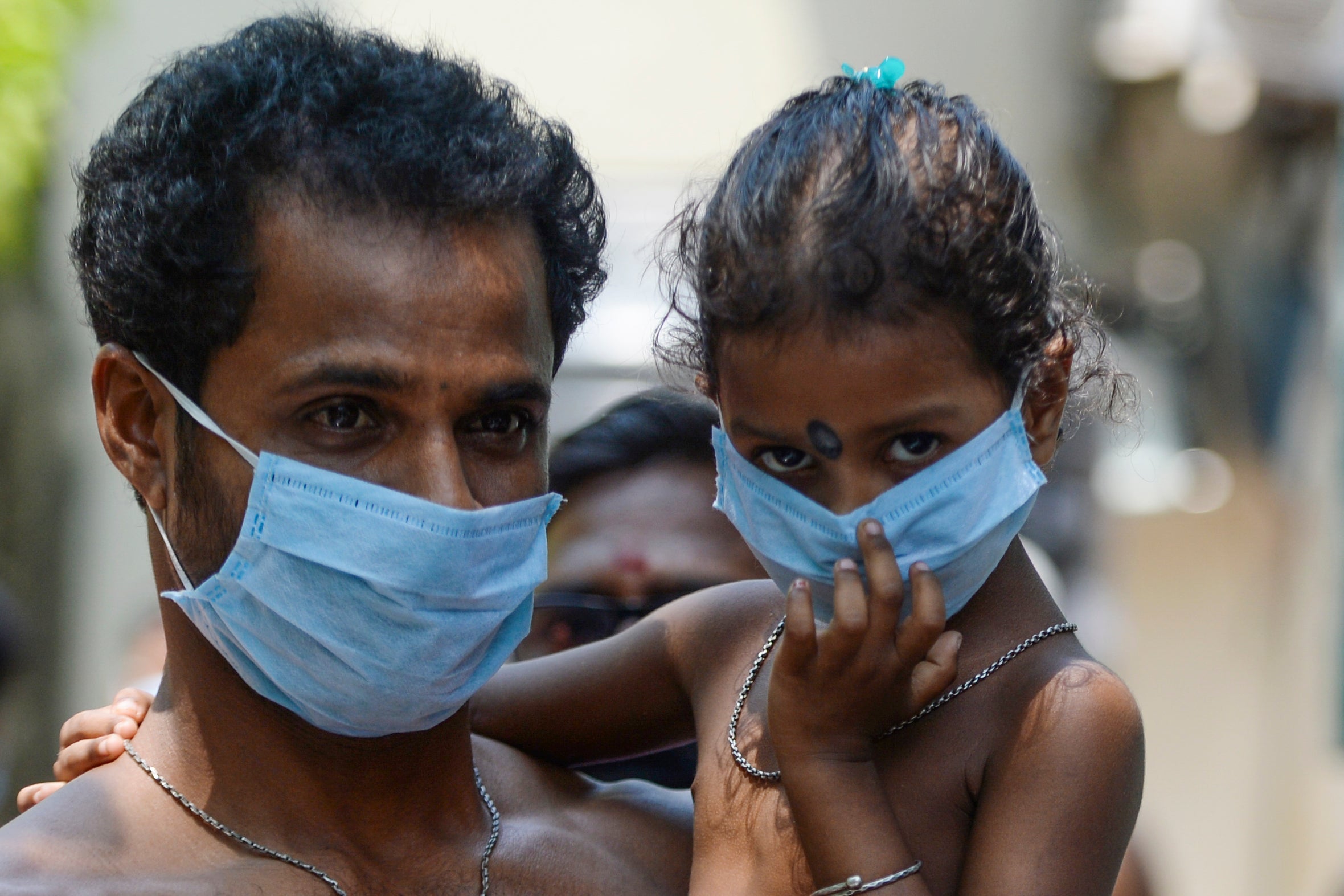 A migrant worker and his daughter at a camp in Chennai during the lockdown, April 2020