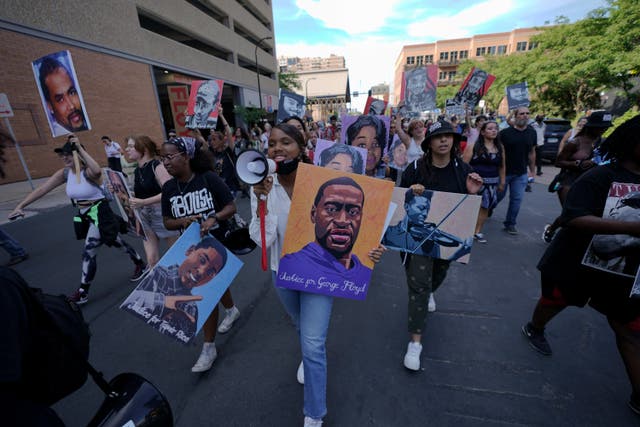 <p>A group of protesters marches after former Minneapolis police officer Derek Chauvin was sentenced to 22.5 years in prison for the murder of George Floyd</p>