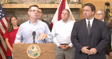 Ron DeSantis stands by as city worker falsely claims vaccines ‘change your RNA’ at press conference