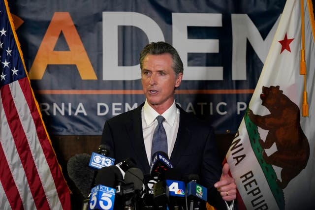 <p>California governor Gavin Newsom addresses reporters after beating back the recall attempt that aimed to remove him from office, at the John L Burton California Democratic Party headquarters in Sacramento, California, on Tuesday</p>