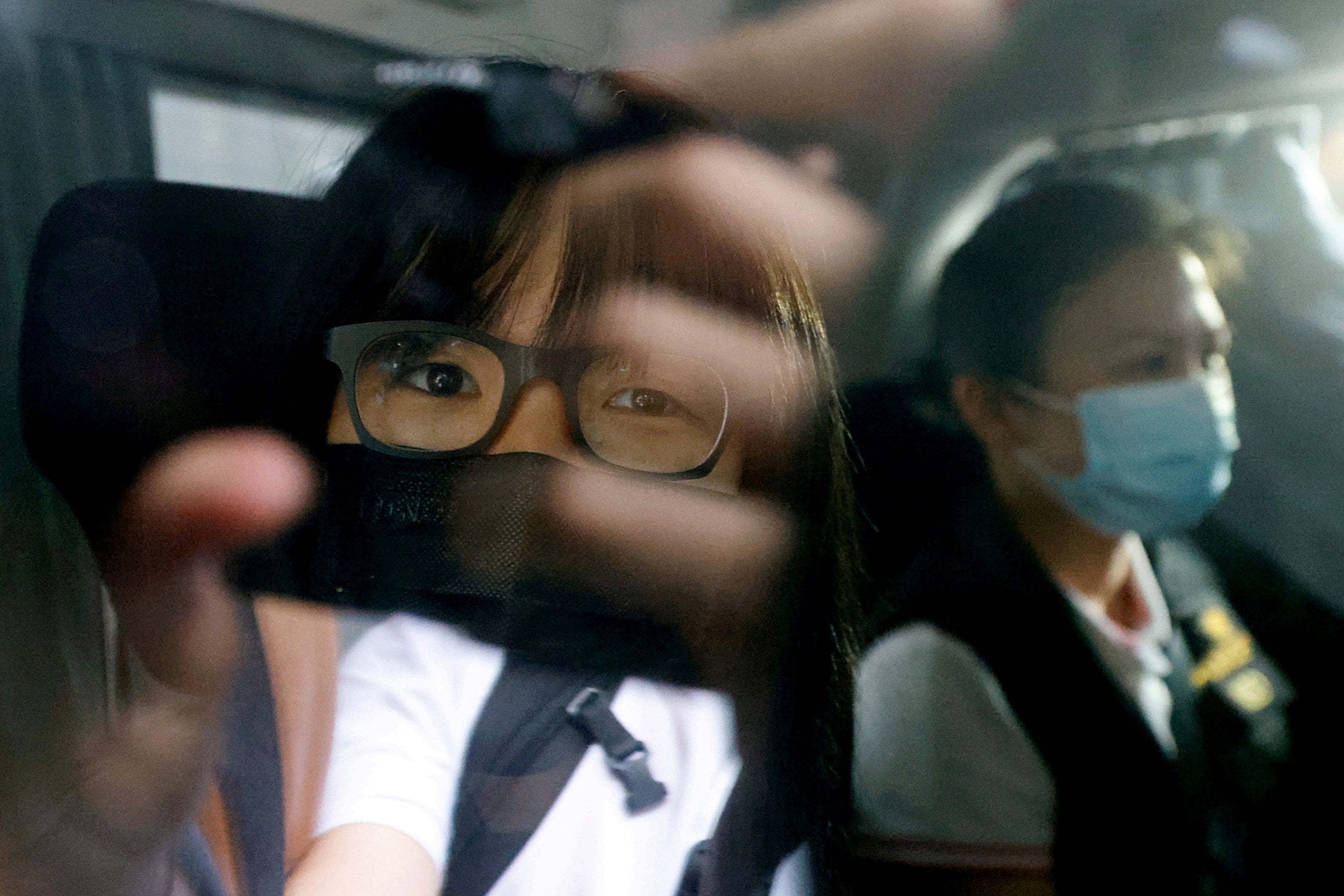 Hong Kong Alliance Vice-Chairwoman Tonyee Chow was seen inside a vehicle after being detained in Hong Kong