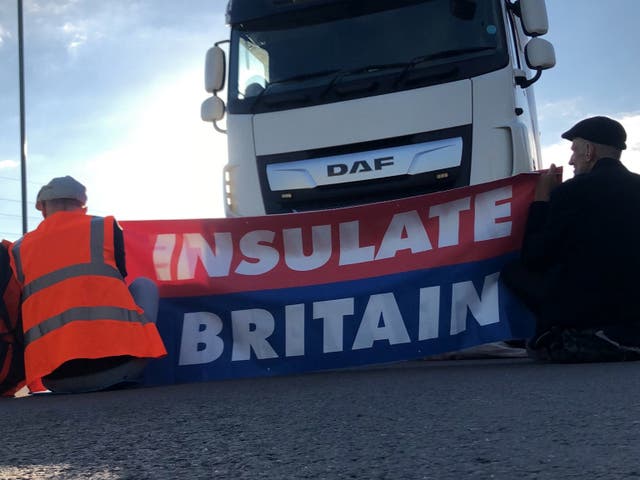 <p>Members of Insulate Britain protest on the M25 motorway</p>