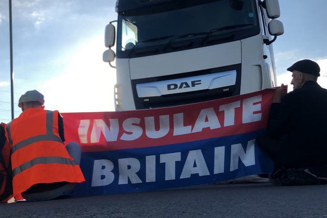 <p>Members of Insulate Britain protest on the M25 motorway</p>