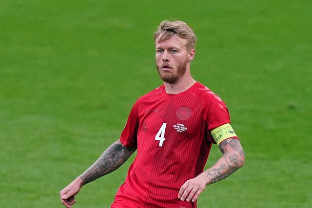 <p>Denmark skipper Simon Kjaer was one of the first to reach Christian Eriksen after his collapse</p>