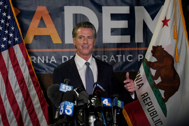 <p>A victorious Newsom talks to reporters at the state’s Democrat HQ in Sacramento on Tuesday </p>