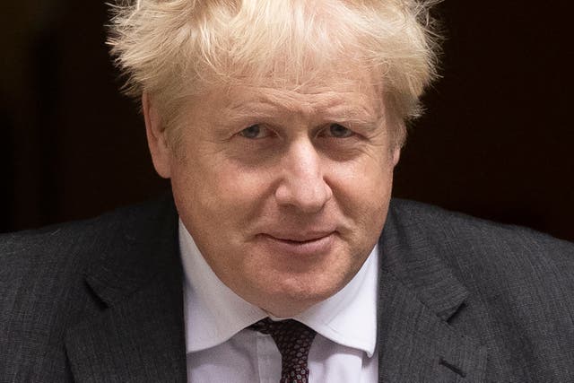 <p>Boris Johnson leaves 10 Downing Street for the weekly Prime Minister’s Questions at the House of Commons on Wednesday </p>