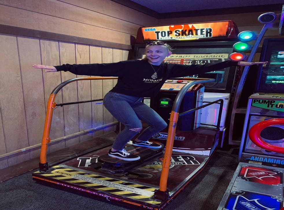 pGabby Petito plays a skateboarding video game at an arcade./p