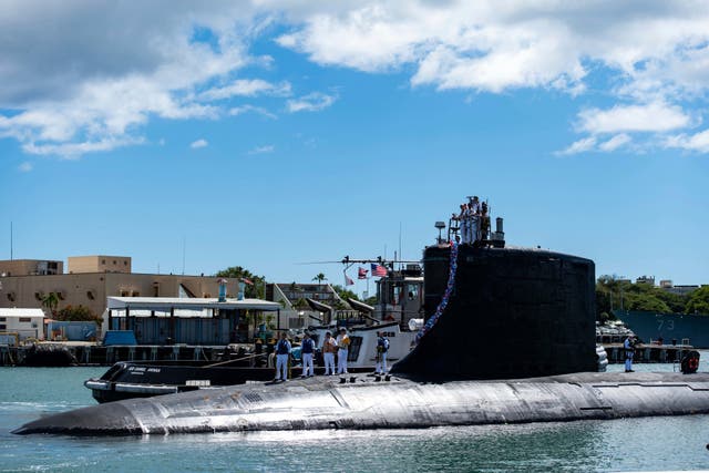 <p>A submarine docked at the Pearl Harbor naval base. </p>