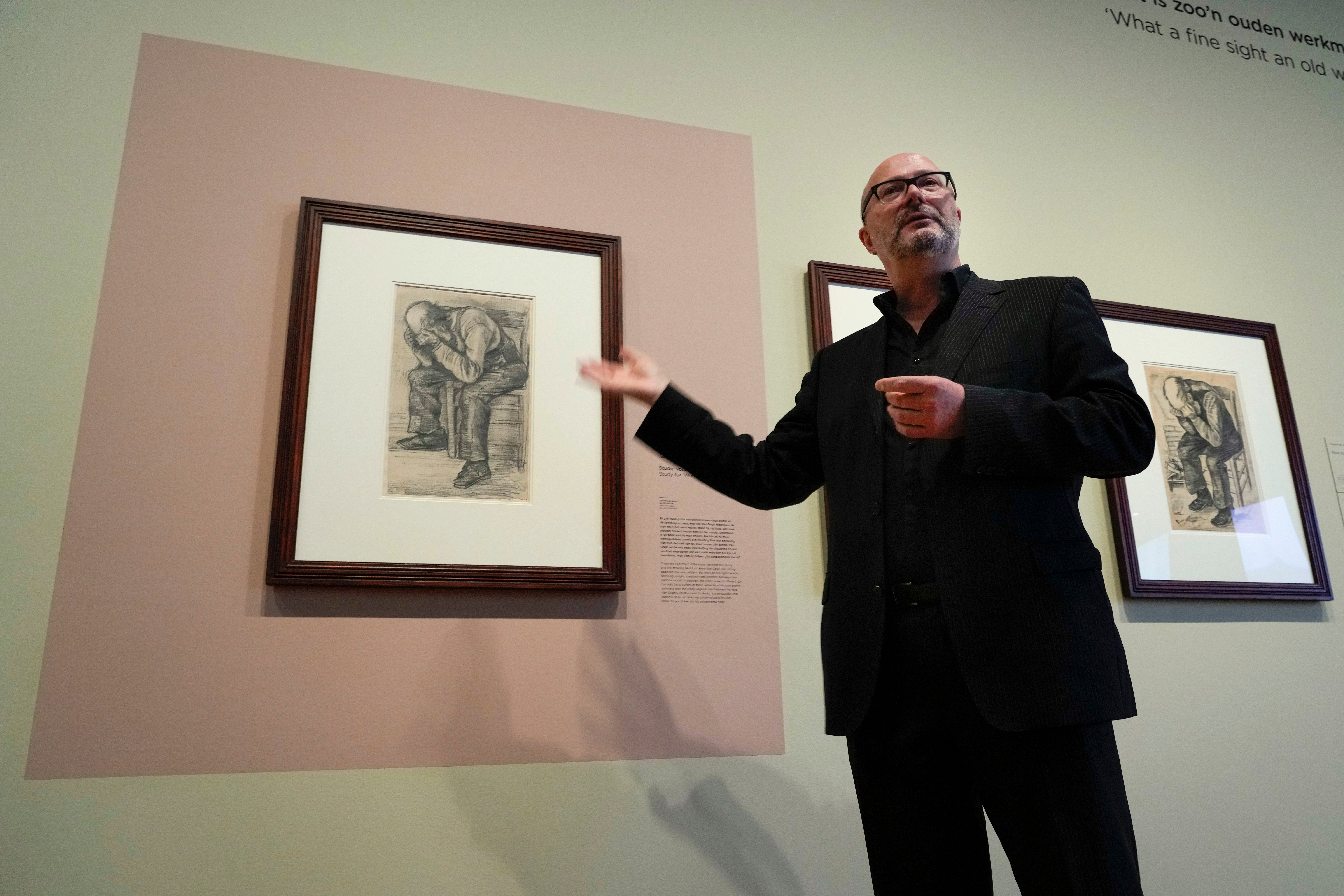 Senior researcher Teio Meedendorp gestures during the presentation of Study for "Worn Out", left, a drawing by Dutch master Vincent van Gogh, dated Nov. 1882, going on public display for the first time at the Van Gogh Museum in Amsterdam